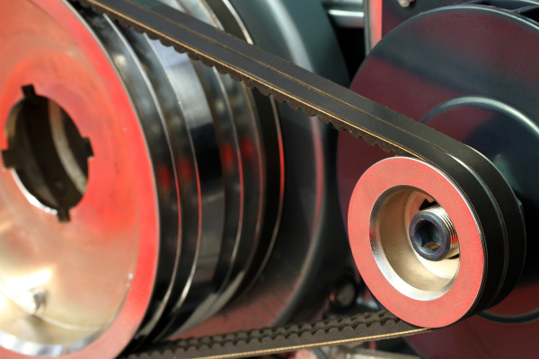 Action shot of an EPDM V-Belt transmitting power in an industrial machine.